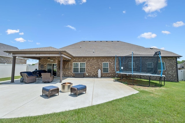 2426 Telford Ln, Murfreesboro, TN 37128 - back of property featuring a trampoline, a patio area, a ceiling fan, and brick siding