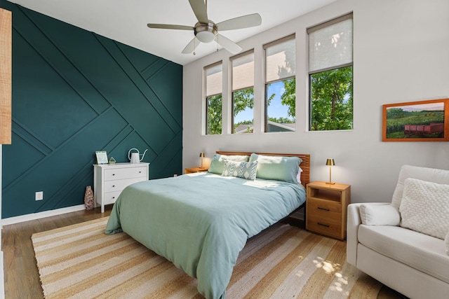 1035 Chester Ave Unit 10, Nashville, TN 37206 - bedroom featuring wood finished floors, a decorative wall, and a ceiling fan