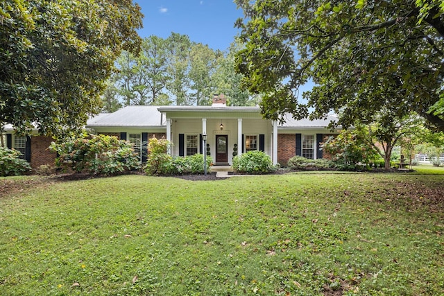 2641 Buckner Rd, Thompsons Station, TN 37179 - ranch-style home featuring a front lawn, a chimney, a porch, and brick siding