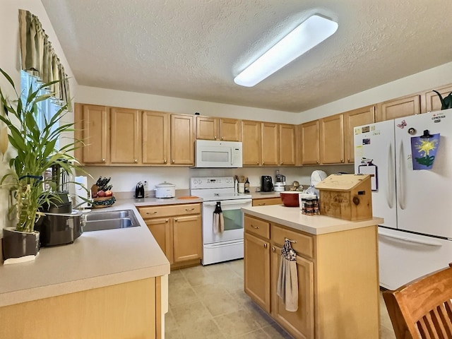 3525 Chandler Cove Way, Antioch, TN 37013 - kitchen with white appliances, a textured ceiling, light countertops, light brown cabinetry, and a center island