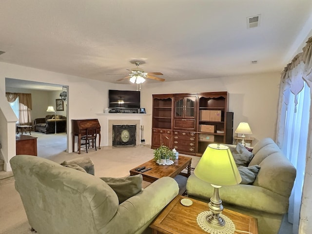 3525 Chandler Cove Way, Antioch, TN 37013 - living area with a fireplace with flush hearth, a ceiling fan, and carpet