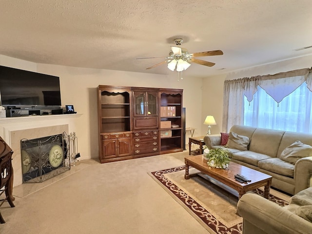3525 Chandler Cove Way, Antioch, TN 37013 - living area featuring a ceiling fan, carpet flooring, a fireplace, and a textured ceiling