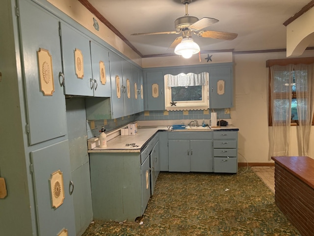 887 Elwood Dr, Clarksville, TN 37040 - kitchen featuring crown molding, a ceiling fan, and light countertops