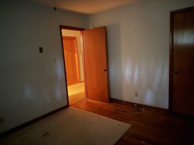 887 Elwood Dr, Clarksville, TN 37040 - unfurnished bedroom featuring wood finished floors and baseboards
