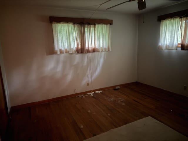 887 Elwood Dr, Clarksville, TN 37040 - empty room with ceiling fan, wood finished floors, and healthy amount of natural light
