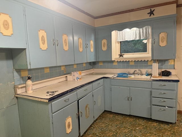 887 Elwood Dr, Clarksville, TN 37040 - kitchen with backsplash, crown molding, light countertops, and dark floors