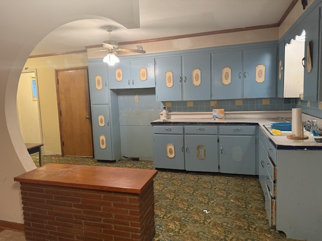 887 Elwood Dr, Clarksville, TN 37040 - kitchen with arched walkways, a ceiling fan, decorative backsplash, and ornamental molding