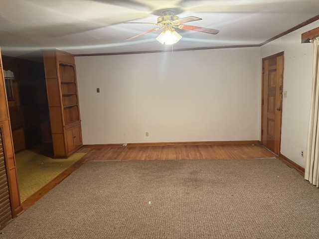 887 Elwood Dr, Clarksville, TN 37040 - spare room featuring ceiling fan, light wood-style flooring, light carpet, and crown molding