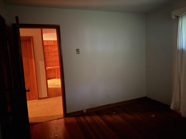 887 Elwood Dr, Clarksville, TN 37040 - unfurnished room with dark wood-type flooring and baseboards