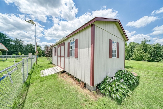 125 Clarence Lee Rd, Lancing, TN 37770 - view of side of home featuring a fenced backyard and an outdoor structure