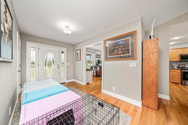125 Clarence Lee Rd, Lancing, TN 37770 - entryway featuring light wood-type flooring and baseboards