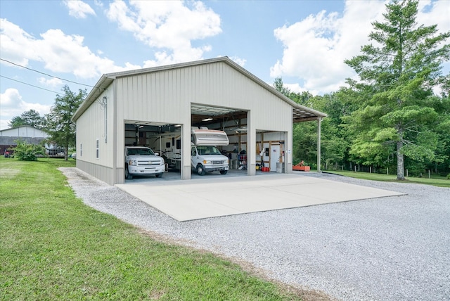 125 Clarence Lee Rd, Lancing, TN 37770 - view of pole building featuring a lawn and driveway