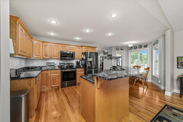 125 Clarence Lee Rd, Lancing, TN 37770 - kitchen with refrigerator with ice dispenser, electric range oven, stainless steel microwave, recessed lighting, and a kitchen bar