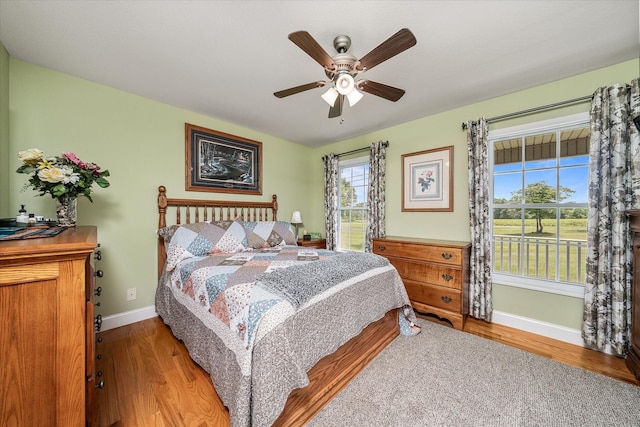 125 Clarence Lee Rd, Lancing, TN 37770 - bedroom featuring wood finished floors and ceiling fan