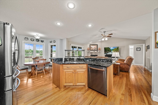 125 Clarence Lee Rd, Lancing, TN 37770 - kitchen with stainless steel appliances, open floor plan, light wood-style floors, a ceiling fan, and recessed lighting