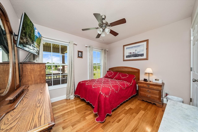 125 Clarence Lee Rd, Lancing, TN 37770 - bedroom featuring light wood-type flooring and a ceiling fan