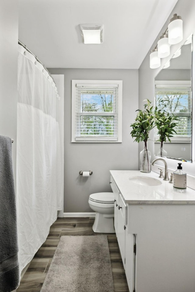 6002 Temple Rd, Nashville, TN 37221 - full bath with vanity, wood finished floors, and curtained shower