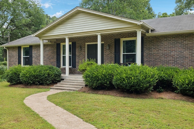 6002 Temple Rd, Nashville, TN 37221 - view of front facade featuring brick siding, a porch, a front yard, and roof with shingles