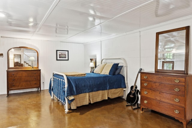 6002 Temple Rd, Nashville, TN 37221 - bedroom featuring finished concrete flooring and concrete block wall