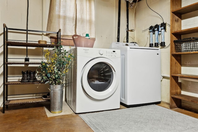 6002 Temple Rd, Nashville, TN 37221 - laundry room with concrete block wall and separate washer and dryer
