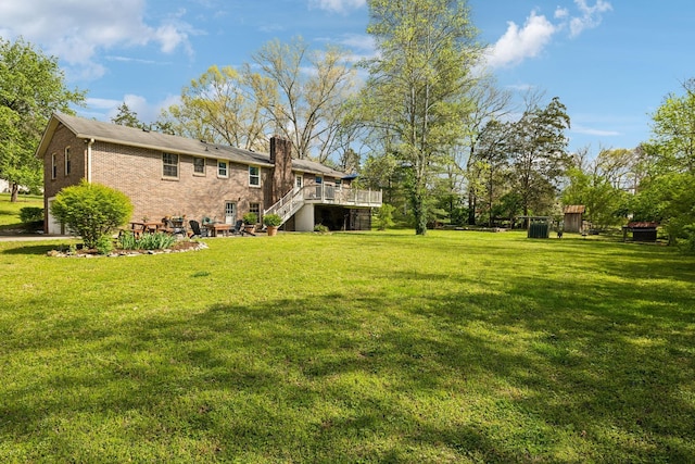 6002 Temple Rd, Nashville, TN 37221 - view of green lawn featuring stairs and a deck