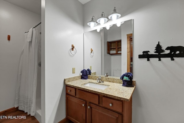 849 Golf View Blvd, Pigeon Forge, TN 37863 - full bathroom featuring vanity, wood finished floors, and curtained shower