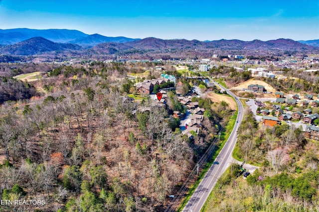 849 Golf View Blvd, Pigeon Forge, TN 37863 - aerial view of property and surrounding area featuring a mountainous background and nearby suburban area