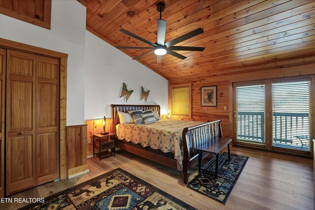 849 Golf View Blvd, Pigeon Forge, TN 37863 - bedroom featuring vaulted ceiling, wood walls, wainscoting, light wood-style floors, and wooden ceiling