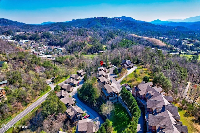 849 Golf View Blvd, Pigeon Forge, TN 37863 - aerial view of property's location featuring a mountain backdrop and nearby suburban area