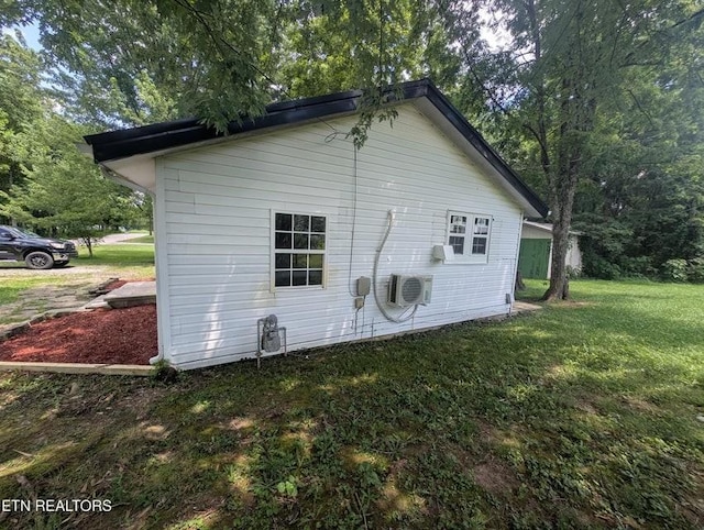 1014 Frank Campbell Rd, Jamestown, TN 38556 - view of home's exterior featuring a lawn and an AC wall unit