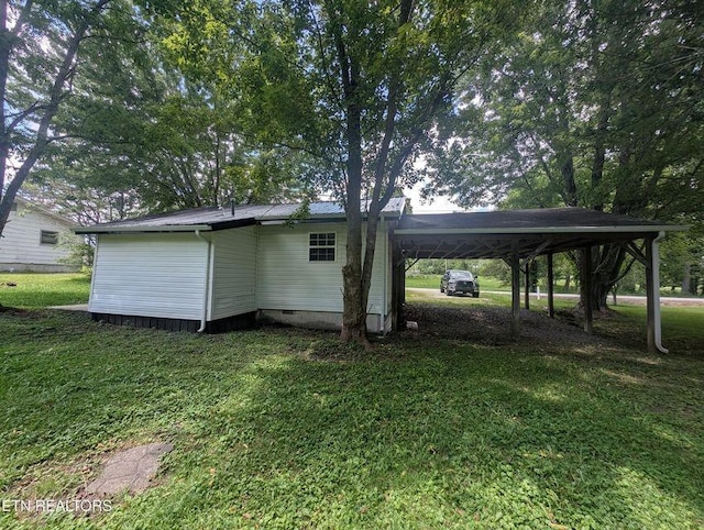 1014 Frank Campbell Rd, Jamestown, TN 38556 - back of property with a yard, an attached carport, and crawl space