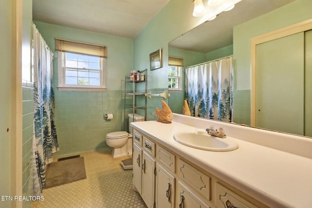 110 Clark Ave, Jamestown, TN 38556 - bathroom featuring tile walls, vanity, wainscoting, curtained shower, and tile patterned floors