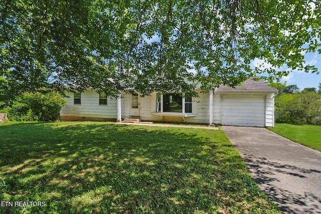 110 Clark Ave, Jamestown, TN 38556 - view of front of house with concrete driveway, an attached garage, and a front yard