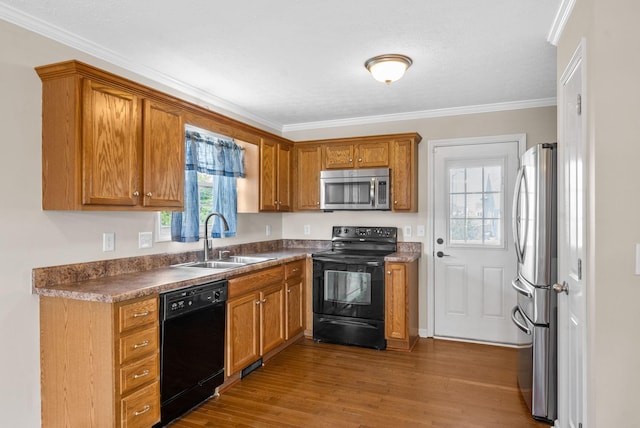 3792 Cindy Jo Dr N, Clarksville, TN 37040 - kitchen featuring black appliances, brown cabinets, wood finished floors, and ornamental molding
