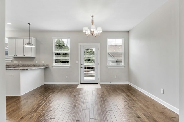 708 Ellie Dr, Madison, TN 37115 - doorway to outside featuring a chandelier, plenty of natural light, and wood finished floors