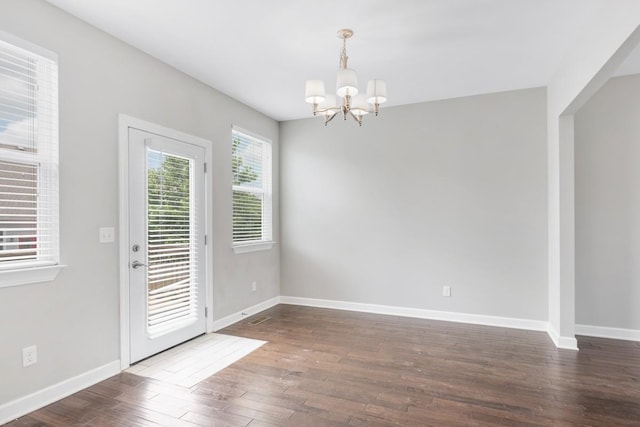 708 Ellie Dr, Madison, TN 37115 - unfurnished dining area with a chandelier and dark wood finished floors