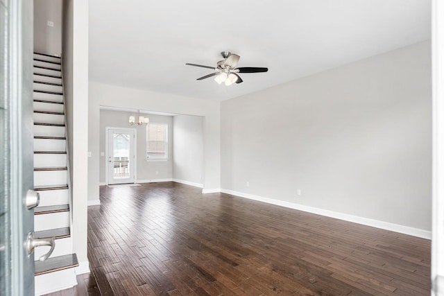 708 Ellie Dr, Madison, TN 37115 - unfurnished living room with stairway, a chandelier, a ceiling fan, and dark wood-style flooring