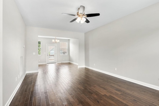 708 Ellie Dr, Madison, TN 37115 - unfurnished living room with a chandelier, dark wood-type flooring, and a ceiling fan