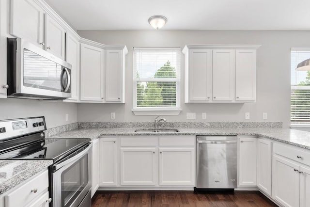 708 Ellie Dr, Madison, TN 37115 - kitchen featuring stainless steel appliances, white cabinetry, and light stone countertops