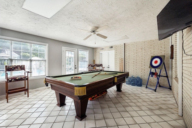 223 Kennett Rd, Old Hickory, TN 37138 - playroom featuring brick wall, a textured ceiling, ceiling fan, billiards table, and light tile patterned floors
