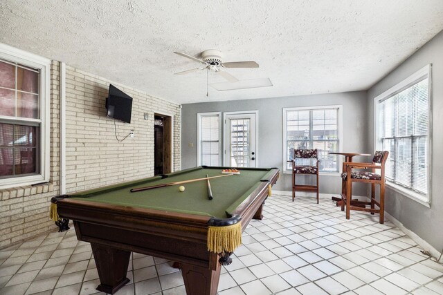 223 Kennett Rd, Old Hickory, TN 37138 - recreation room featuring brick wall, billiards table, light tile patterned floors, a textured ceiling, and a ceiling fan
