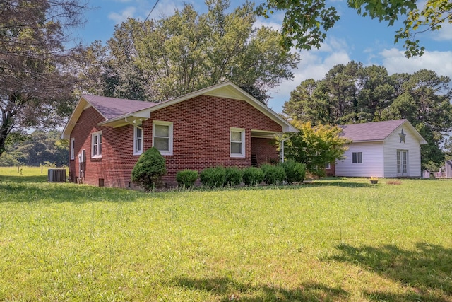 1539 Old Florence Rd, Lawrenceburg, TN 38464 - view of property exterior with brick siding and a lawn