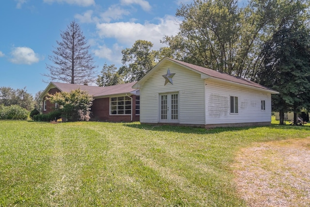 1539 Old Florence Rd, Lawrenceburg, TN 38464 - back of house with french doors and a lawn