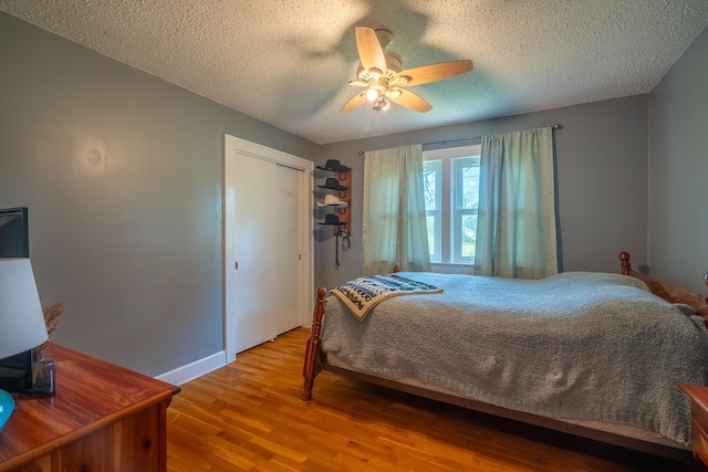 1539 Old Florence Rd, Lawrenceburg, TN 38464 - bedroom with a textured ceiling, wood finished floors, a ceiling fan, and a closet