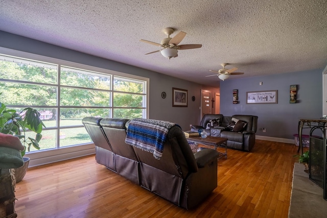 1539 Old Florence Rd, Lawrenceburg, TN 38464 - living room with ceiling fan, a textured ceiling, and wood finished floors