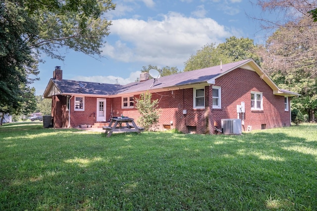 1539 Old Florence Rd, Lawrenceburg, TN 38464 - rear view of house with a chimney, brick siding, a yard, and a patio