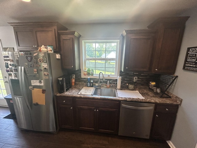49 Rebecca Ln W, Estill Springs, TN 37330 - kitchen with appliances with stainless steel finishes, plenty of natural light, backsplash, and dark brown cabinetry