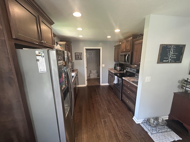 49 Rebecca Ln W, Estill Springs, TN 37330 - kitchen with appliances with stainless steel finishes, dark brown cabinets, dark wood-style floors, and recessed lighting