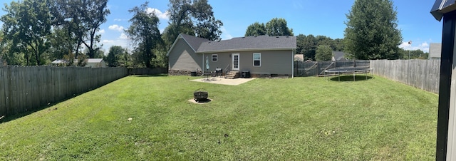49 Rebecca Ln W, Estill Springs, TN 37330 - back of house featuring a trampoline, a fenced backyard, crawl space, and a patio