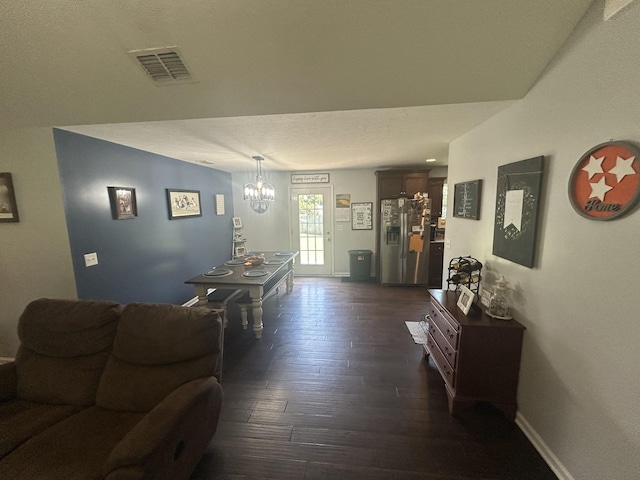 49 Rebecca Ln W, Estill Springs, TN 37330 - living area with a chandelier and dark wood-style flooring